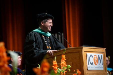 Dr. Thomas Mohr addresses graduates and guests at ICOM’s inaugural commencement ceremony on May 13, 2022.